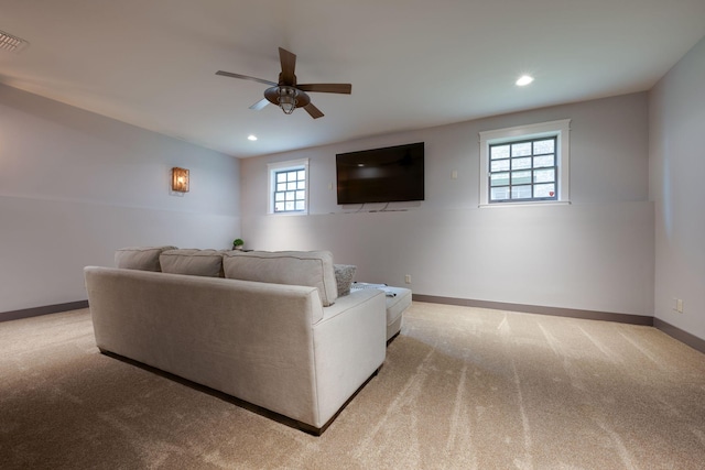 living room featuring carpet floors, a ceiling fan, baseboards, and recessed lighting