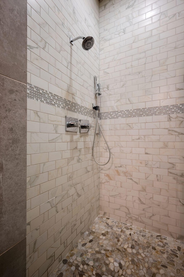 full bathroom with tiled shower