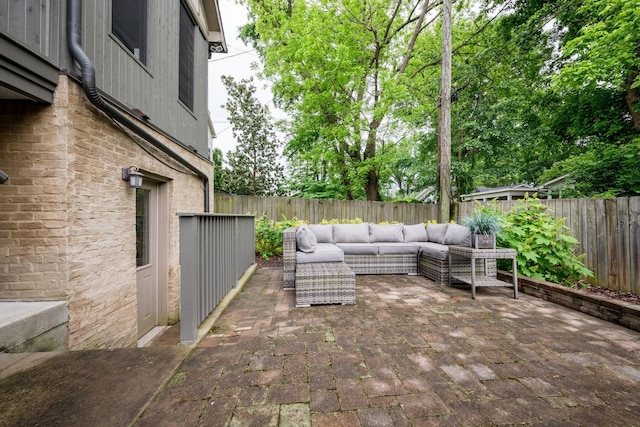 view of patio featuring an outdoor hangout area and a fenced backyard