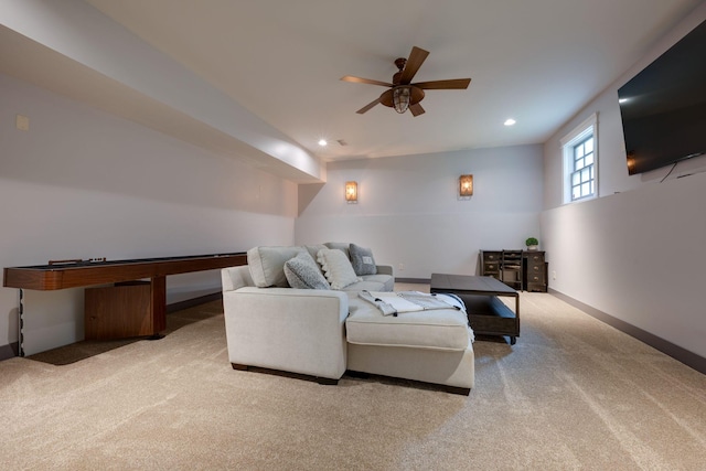 carpeted living area featuring a ceiling fan, recessed lighting, and baseboards