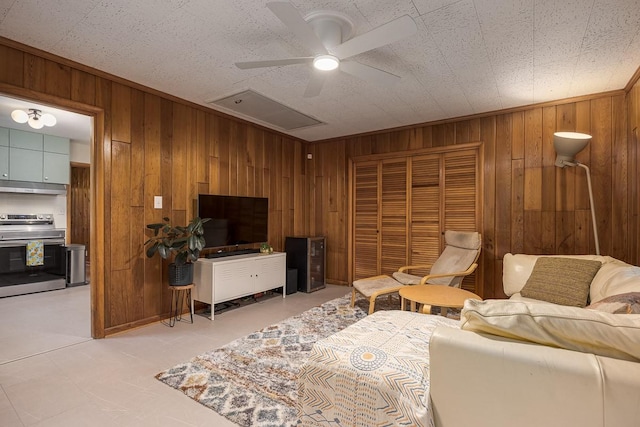 2413 Dundee Ln, Nashville, TN 37214 - living room featuring wooden walls and a ceiling fan