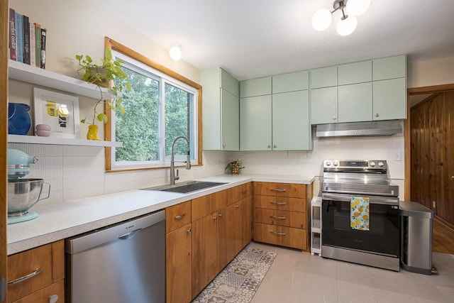 2413 Dundee Ln, Nashville, TN 37214 - kitchen with stainless steel appliances, a sink, open shelves, under cabinet range hood, and tasteful backsplash