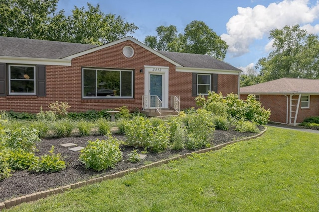 2413 Dundee Ln, Nashville, TN 37214 - ranch-style house with a front yard, brick siding, and a shingled roof