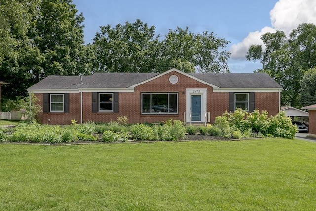 2413 Dundee Ln, Nashville, TN 37214 - ranch-style home featuring a front yard, brick siding, and a shingled roof