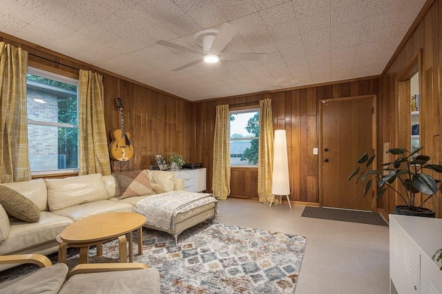 2413 Dundee Ln, Nashville, TN 37214 - living area featuring wood walls, ceiling fan, and light floors