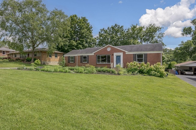 2413 Dundee Ln, Nashville, TN 37214 - ranch-style home with brick siding, a front lawn, and a carport