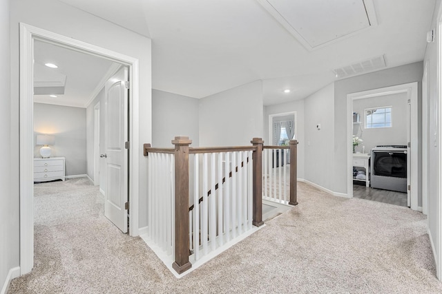 1006 Brinxton Run, Murfreesboro, TN 37128 - corridor featuring attic access, an upstairs landing, washer / clothes dryer, carpet, and baseboards