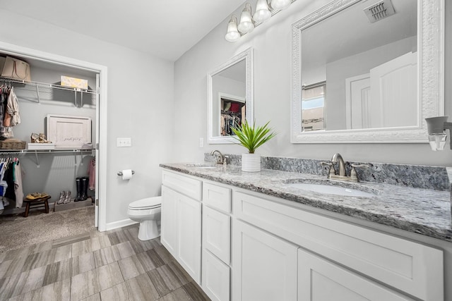 1006 Brinxton Run, Murfreesboro, TN 37128 - bathroom with a walk in closet, double vanity, and toilet