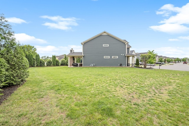 1006 Brinxton Run, Murfreesboro, TN 37128 - back of property with a yard and a chimney