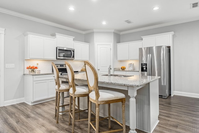 1006 Brinxton Run, Murfreesboro, TN 37128 - kitchen with appliances with stainless steel finishes, a sink, dark wood finished floors, backsplash, and white cabinets