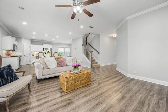 1006 Brinxton Run, Murfreesboro, TN 37128 - living room with ornamental molding, stairs, a ceiling fan, recessed lighting, and light wood-type flooring