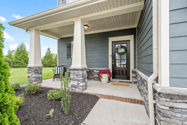 1006 Brinxton Run, Murfreesboro, TN 37128 - doorway to property featuring a porch and stone siding