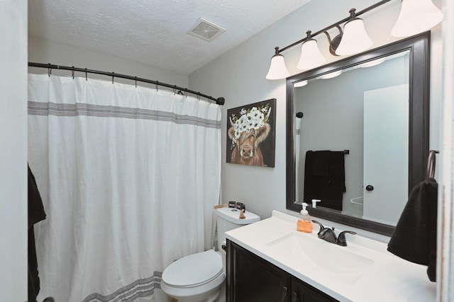 full bathroom featuring vanity, toilet, a textured ceiling, and curtained shower