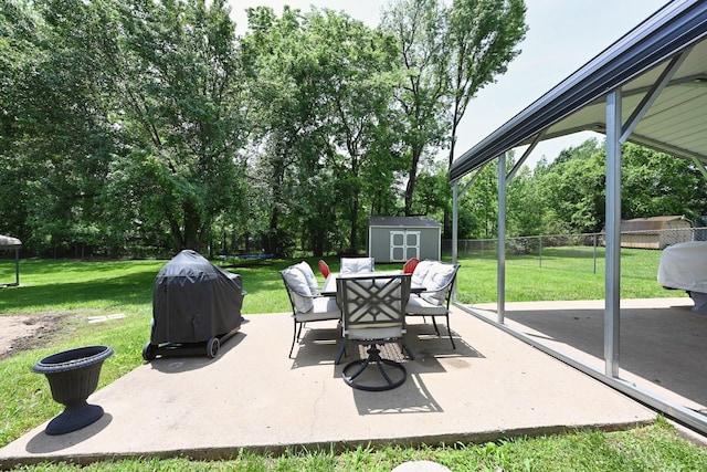 view of patio with outdoor dining space, a storage unit, a trampoline, an outdoor structure, and grilling area