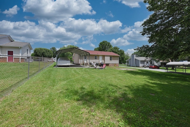 back of property with a carport