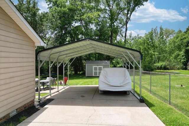 view of parking featuring a storage shed, a detached carport, and driveway