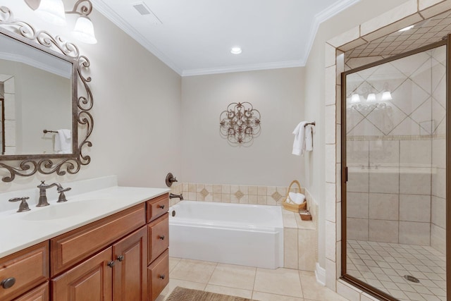 bathroom featuring tile patterned floors, a garden tub, a shower stall, vanity, and crown molding