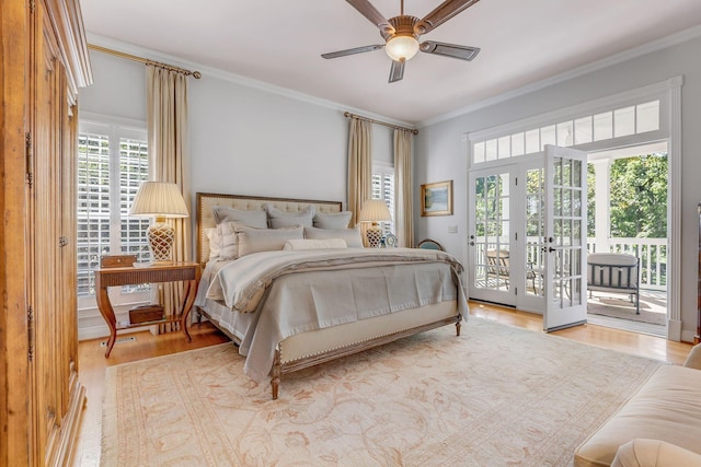bedroom with access to exterior, wood finished floors, crown molding, and ceiling fan