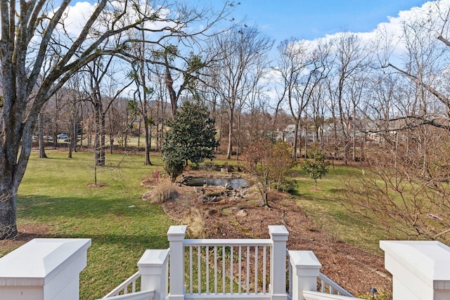 view of green lawn with view of scattered trees
