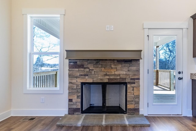 1203 Goose Dr, Springfield, TN 37172 - detailed view of wood finished floors, a fireplace, and baseboards