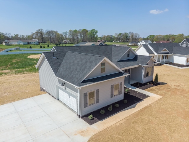 1161 Goose Dr, Springfield, TN 37172 - view of front facade with roof with shingles, concrete driveway, a garage, a residential view, and a front lawn