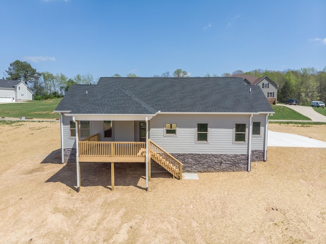 1161 Goose Dr, Springfield, TN 37172 - back of house with a shingled roof, dirt driveway, covered porch, and stairway