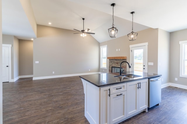 1137 Goose Dr, Springfield, TN 37172 - kitchen featuring dishwasher, a sink, a fireplace, open floor plan, and white cabinets