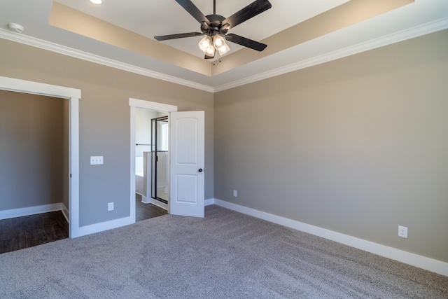 1137 Goose Dr, Springfield, TN 37172 - unfurnished bedroom with dark colored carpet, ornamental molding, a raised ceiling, and baseboards