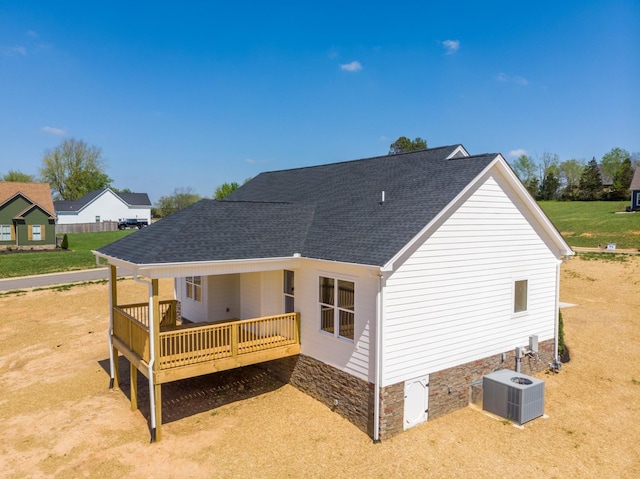 1137 Goose Dr, Springfield, TN 37172 - back of property featuring central AC, roof with shingles, and a deck
