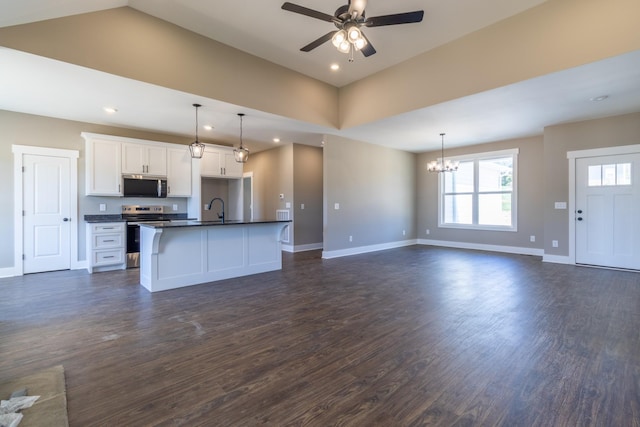 1137 Goose Dr, Springfield, TN 37172 - kitchen with stainless steel appliances, open floor plan, dark countertops, a ceiling fan, and baseboards