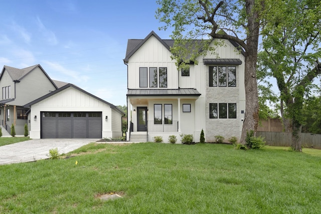 modern farmhouse featuring a porch, a standing seam roof, a garage, concrete driveway, and board and batten siding