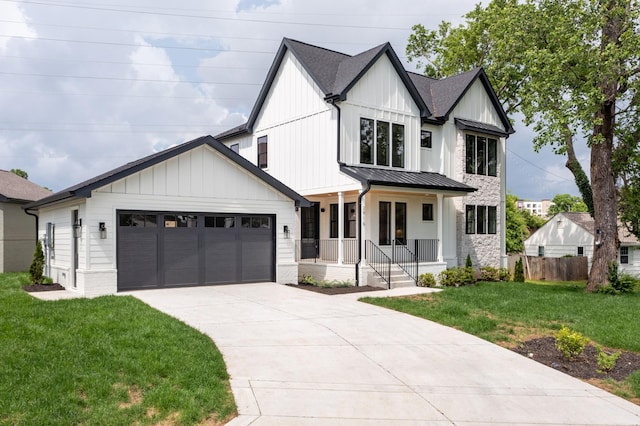 modern farmhouse style home with covered porch, concrete driveway, a standing seam roof, an attached garage, and metal roof