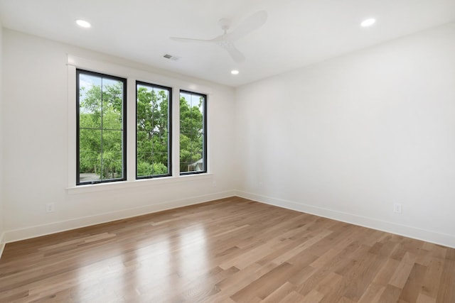 unfurnished room featuring ceiling fan, baseboards, light wood-style floors, and recessed lighting