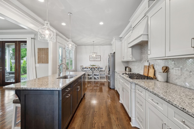 1567 Bunbury Dr, Thompsons Station, TN 37179 - kitchen featuring a sink, appliances with stainless steel finishes, an island with sink, white cabinetry, and dark wood finished floors