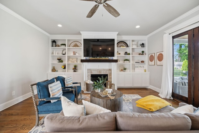 1567 Bunbury Dr, Thompsons Station, TN 37179 - living area with baseboards, crown molding, a fireplace, ceiling fan, and wood finished floors