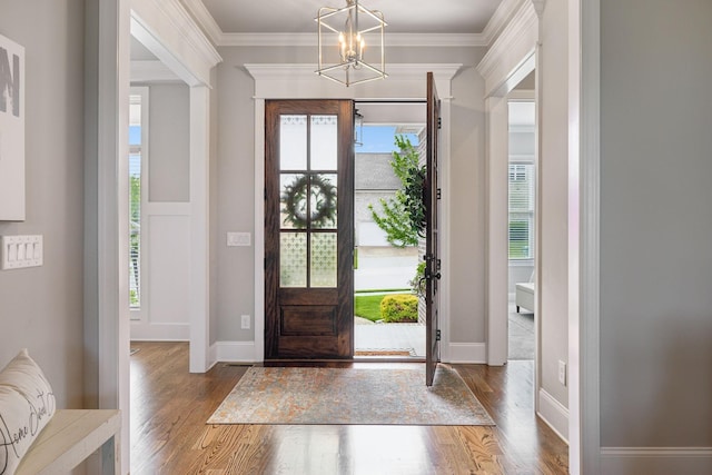 1567 Bunbury Dr, Thompsons Station, TN 37179 - foyer featuring a chandelier, wood finished floors, crown molding, and baseboards