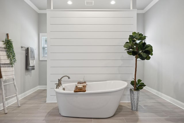 1567 Bunbury Dr, Thompsons Station, TN 37179 - full bath featuring crown molding, baseboards, a freestanding bath, recessed lighting, and wood finish floors