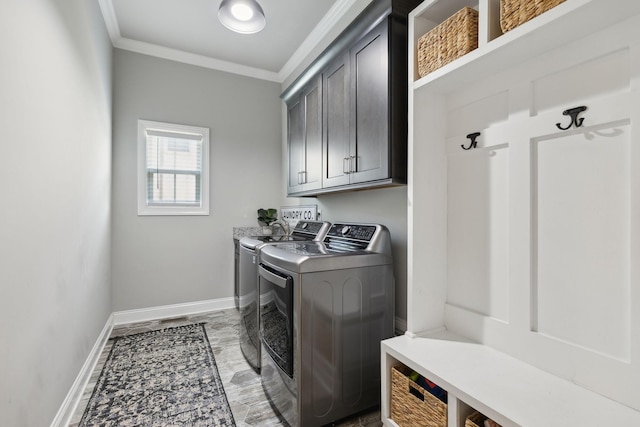 1567 Bunbury Dr, Thompsons Station, TN 37179 - washroom with cabinet space, ornamental molding, baseboards, and washer and clothes dryer