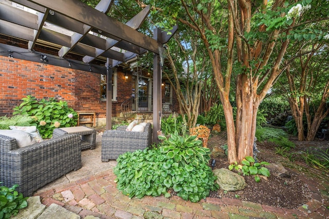 view of patio featuring a pergola and an outdoor hangout area