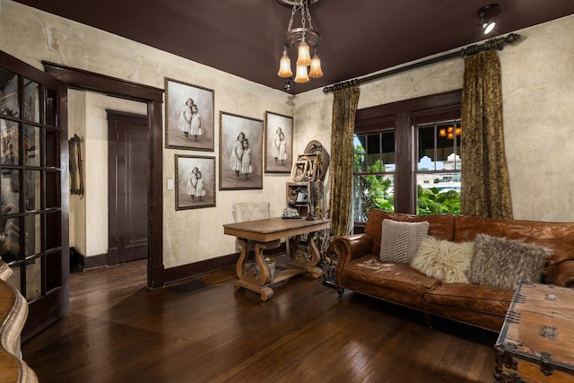 office area featuring hardwood / wood-style floors, baseboards, and a chandelier
