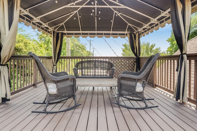 wooden deck featuring a gazebo