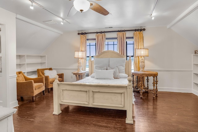 bedroom featuring track lighting, vaulted ceiling, dark wood finished floors, baseboards, and ceiling fan