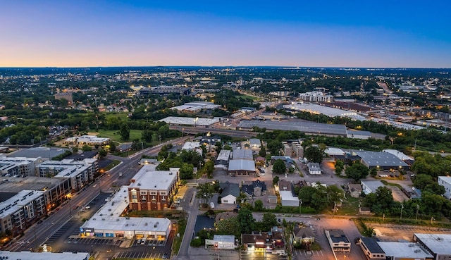 aerial view of property's location featuring nearby urban area