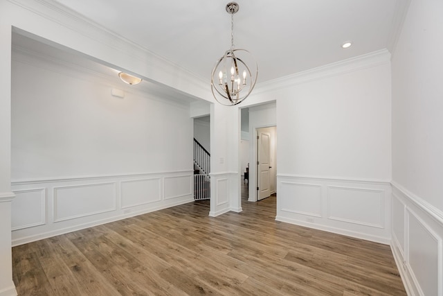 3628 Pelham Wood Dr, Murfreesboro, TN 37128 - unfurnished dining area with a chandelier, stairway, a decorative wall, ornamental molding, and wood finished floors