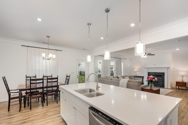 3628 Pelham Wood Dr, Murfreesboro, TN 37128 - kitchen featuring a sink, dishwasher, ornamental molding, light wood finished floors, and a fireplace