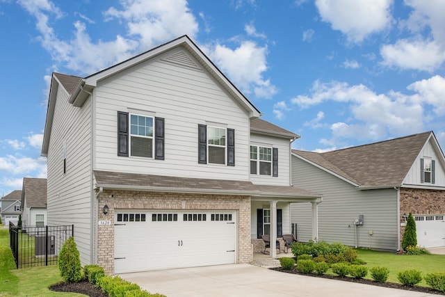 3628 Pelham Wood Dr, Murfreesboro, TN 37128 - view of front facade with an attached garage, driveway, a porch, brick siding, and a shingled roof