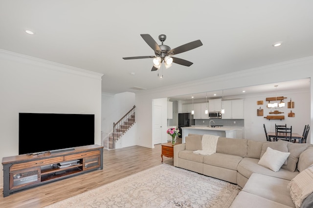3628 Pelham Wood Dr, Murfreesboro, TN 37128 - living room featuring ornamental molding, light wood finished floors, recessed lighting, and a ceiling fan