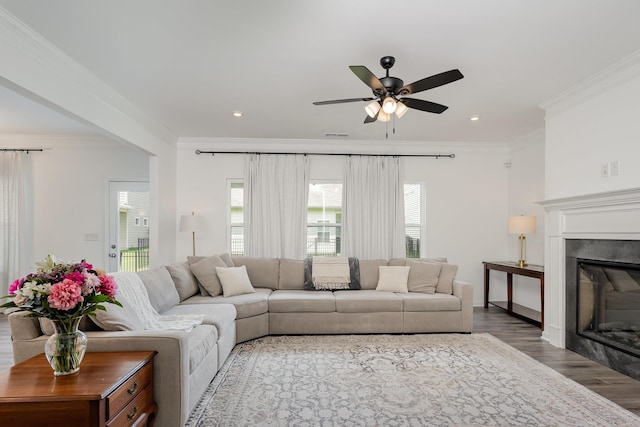 3628 Pelham Wood Dr, Murfreesboro, TN 37128 - living room featuring crown molding, wood finished floors, a glass covered fireplace, ceiling fan, and recessed lighting