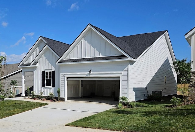 116 Holly Rdg, Antioch, TN 37013 - view of property exterior featuring board and batten siding, an attached garage, a yard, and concrete driveway