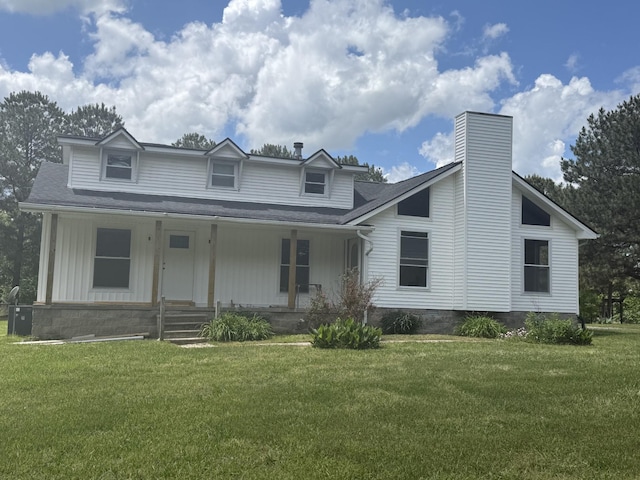 11066 New Cut Off Rd, Bon Aqua, TN 37025 - view of front of house featuring a front yard, covered porch, a chimney, and board and batten siding